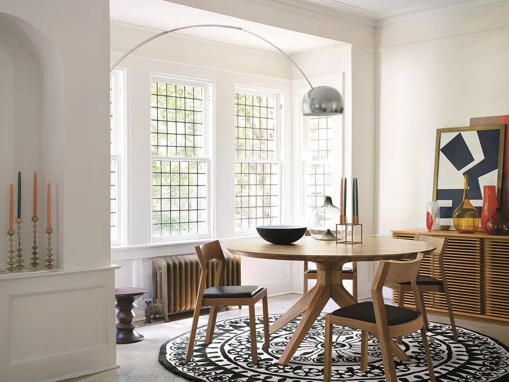 Modern Dining Room with Geometric Rug and Arc Floor Lamp