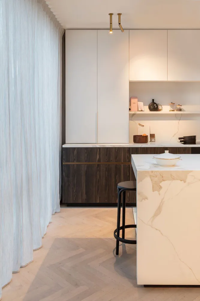 Modern Kitchen Design with Marble Island and Herringbone Flooring