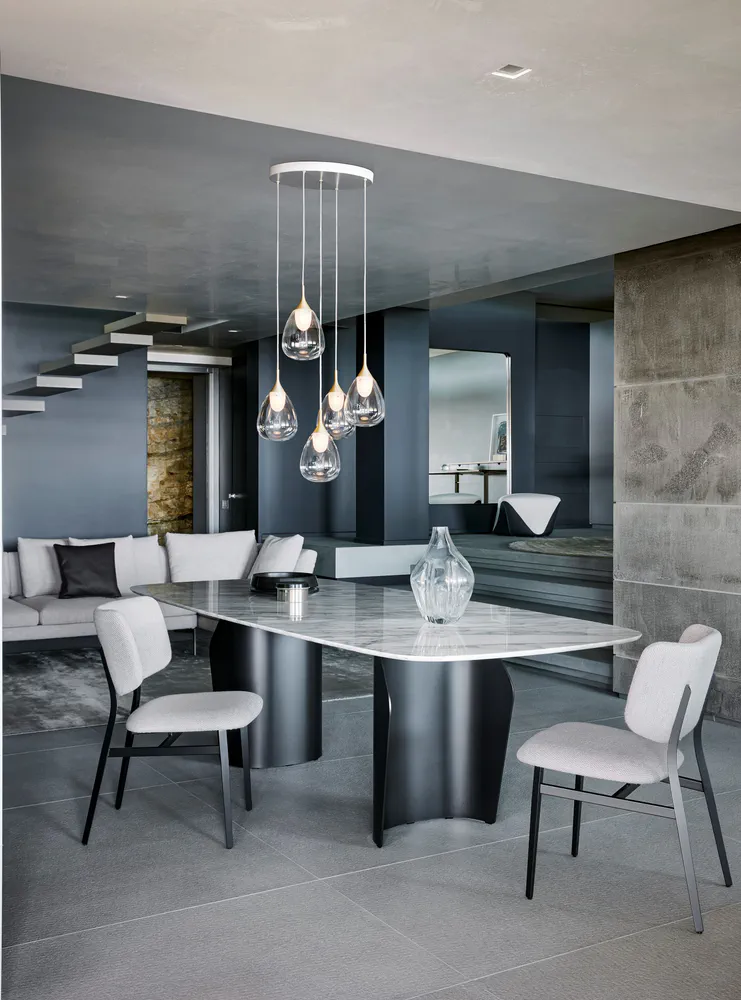 Modern Dining Room with Marble Table and Glass Pendant Lights