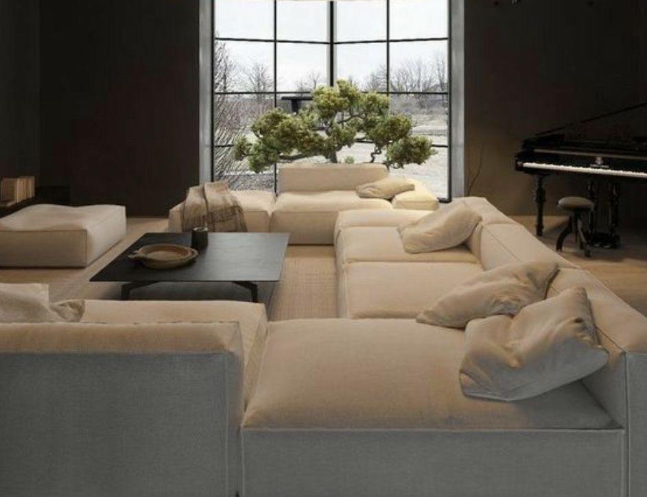 Brutalist Modern Living Room with Concrete Walls and Beige Sectional