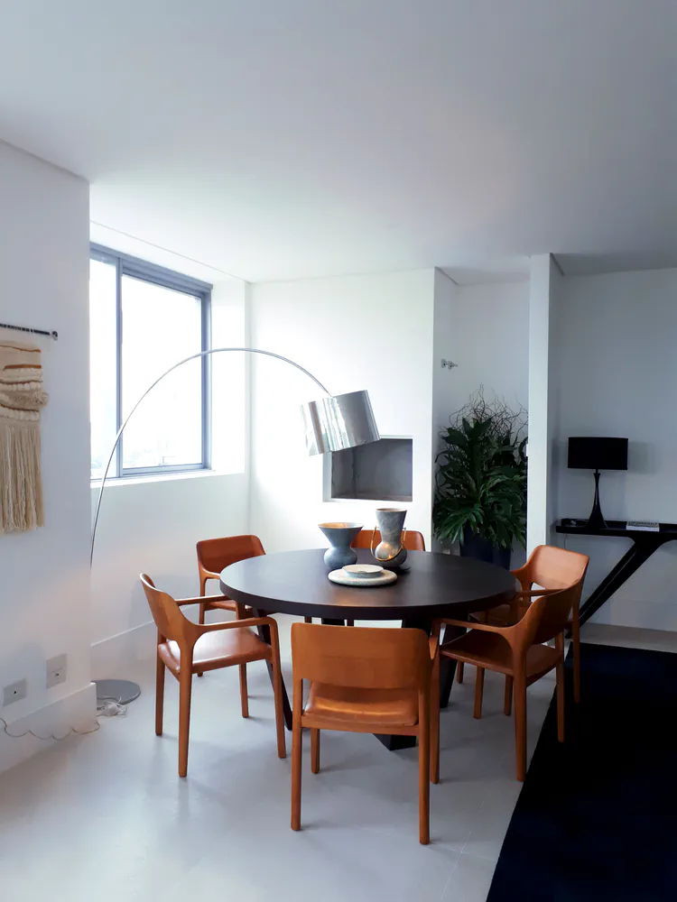 Modern Dining Room with Geometric Rug and Arc Floor Lamp