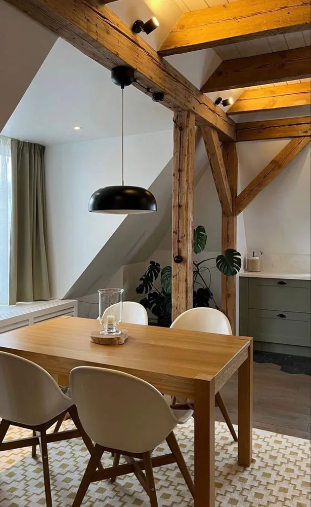 Modern Dining Room with Industrial Pendant Lights and Wooden Beams