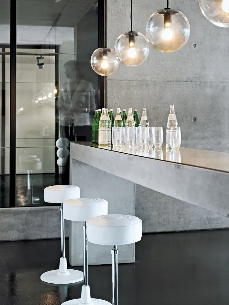 Modern Living Room with Concrete Walls and Glass Pendant Lights