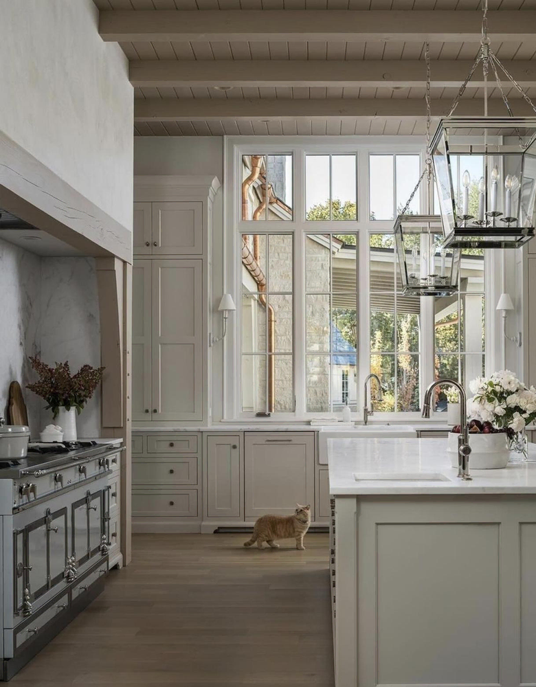 Modern Kitchen Design with White Cabinets and Marble Countertop