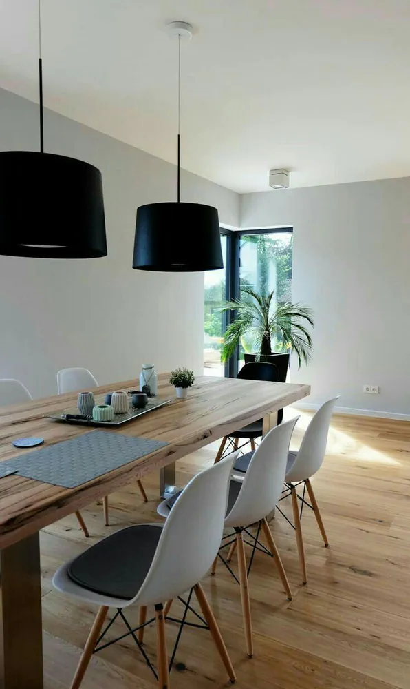 Modern Dining Room with Colorful Chairs and Wooden Table