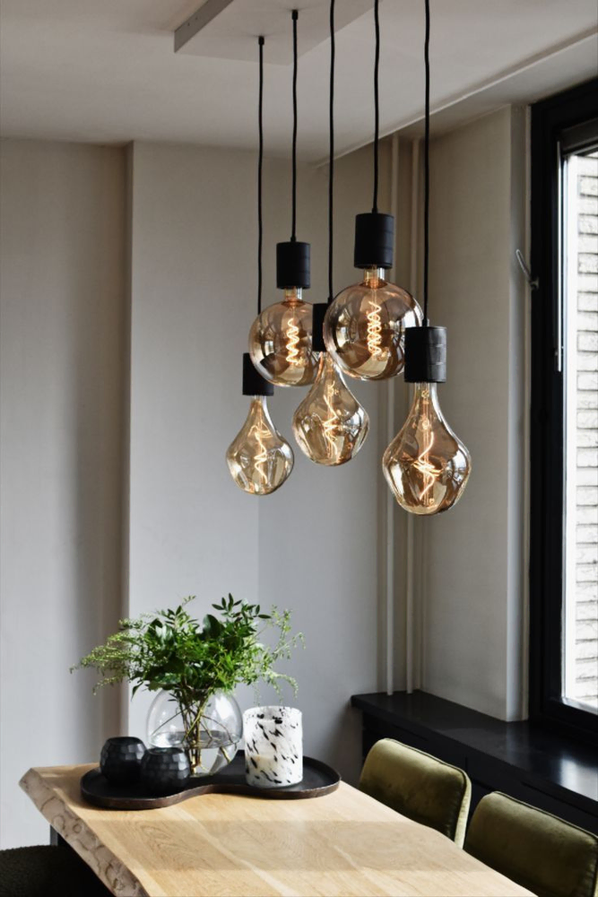 Modern Living Room with Concrete Walls and Glass Pendant Lights