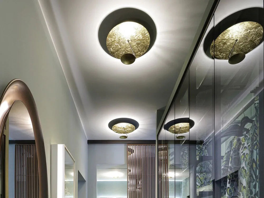 Modern Hallway Design with Circular Light Fixtures and Glass Doors
