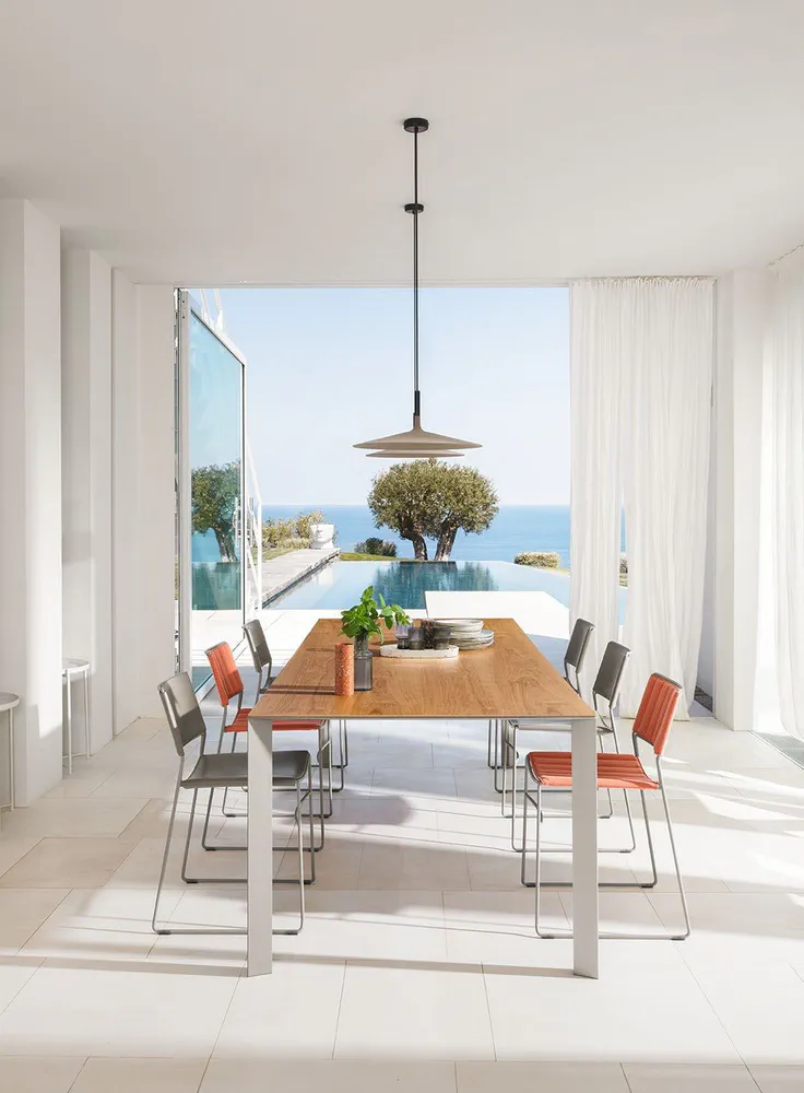 Modern Industrial Dining Room with Ocean View and Sustainable Design