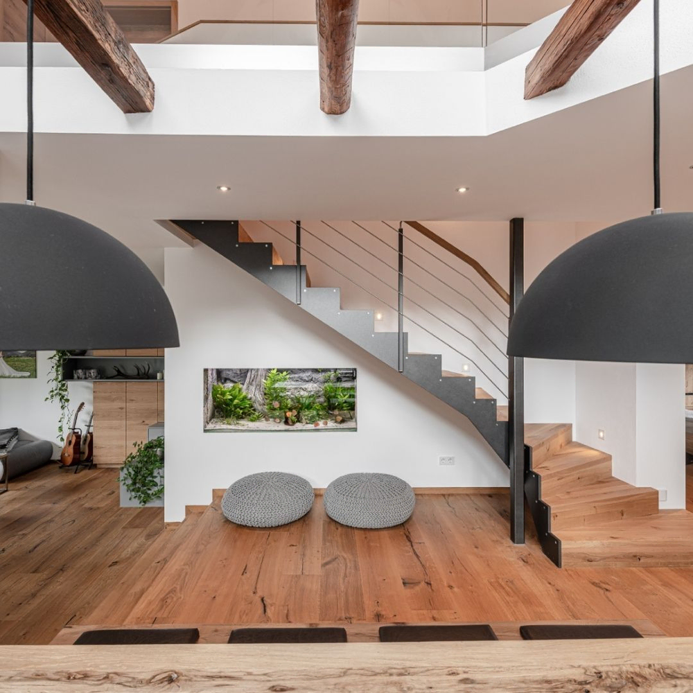 Modern Dining Room with Industrial Pendant Lights and Wooden Beams