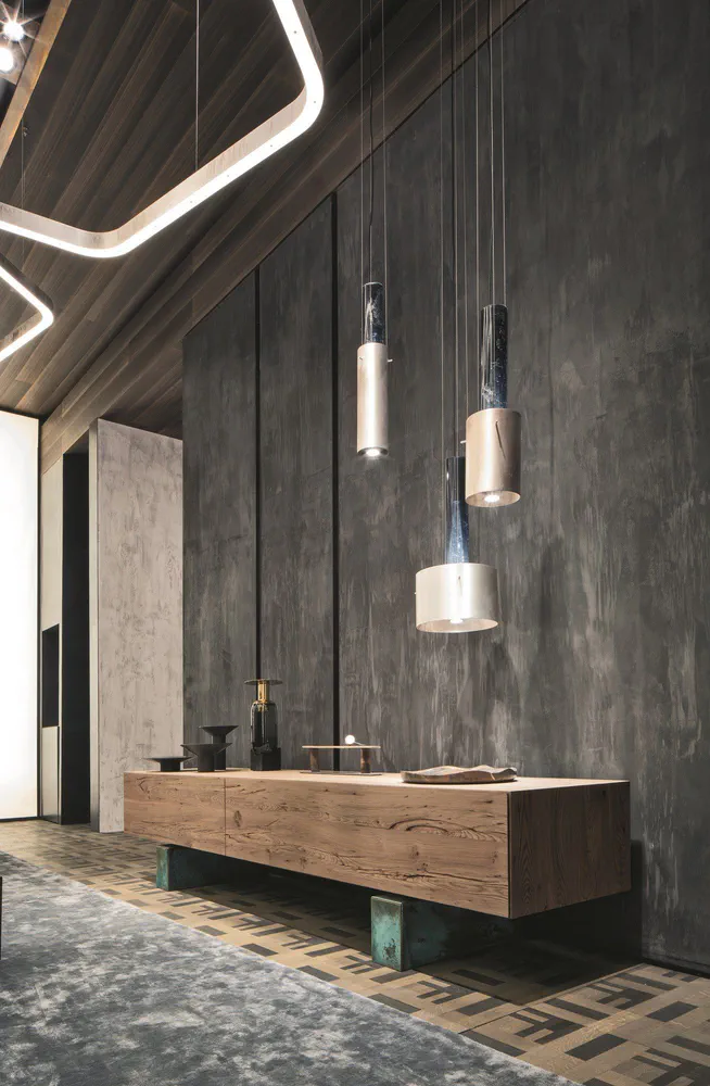 Modern Living Room with Concrete Wall and Metallic Pendant Lights
