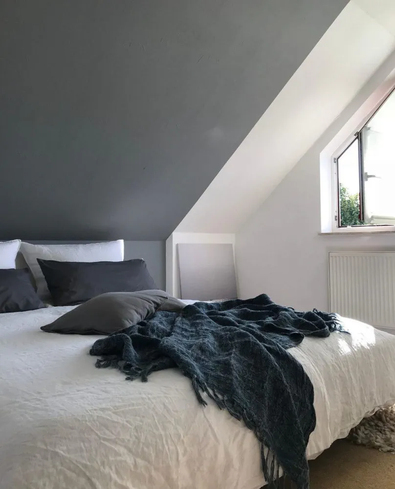 Serene Urban Retreat: A Minimalist Bedroom with Art Gallery Flair