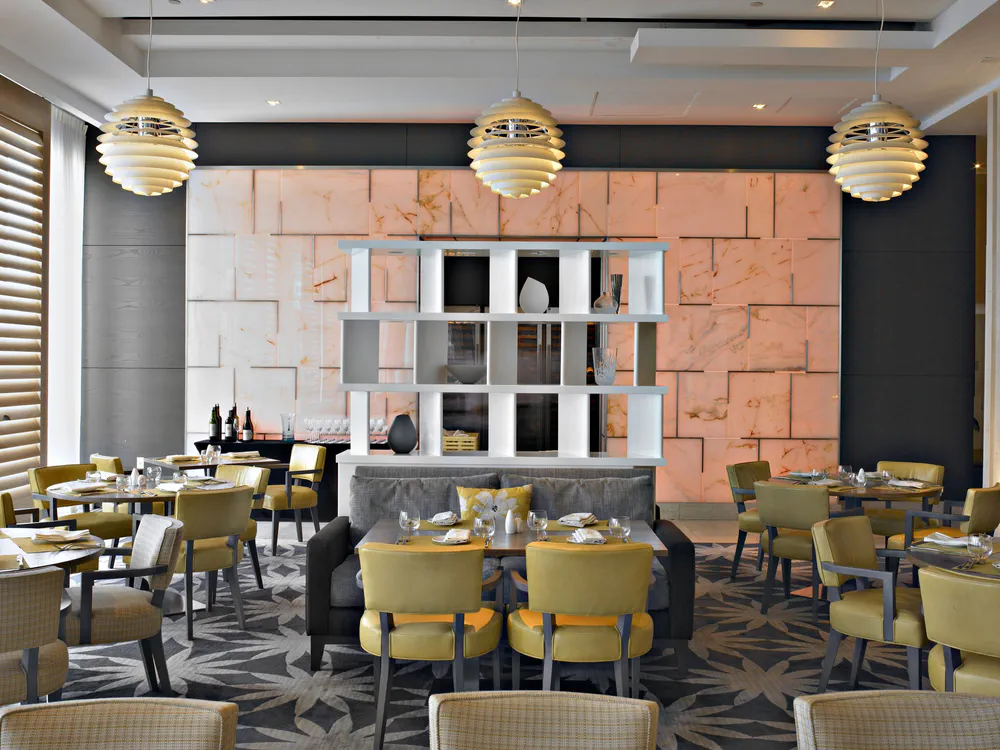 Modern Restaurant Design with Marble and Yellow Accents