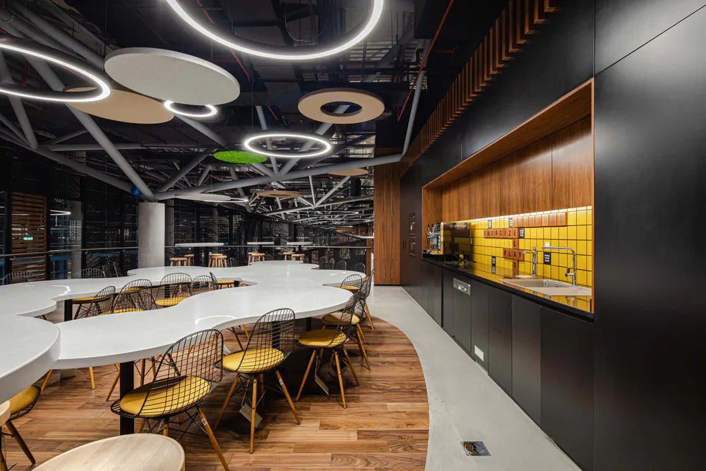 Modern Office Cafeteria Design with Curved Furniture and LED Lighting