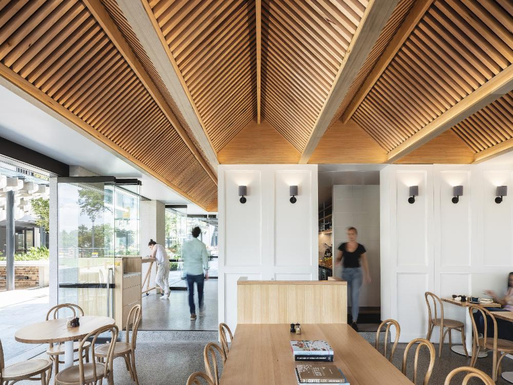 Modern Café Design with Wooden Ceiling and Black Furniture