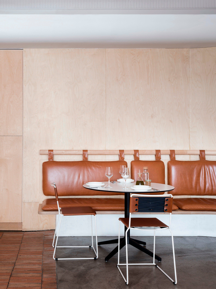 Modern Dining Room with Cane-Backed Chairs and Warm Browns