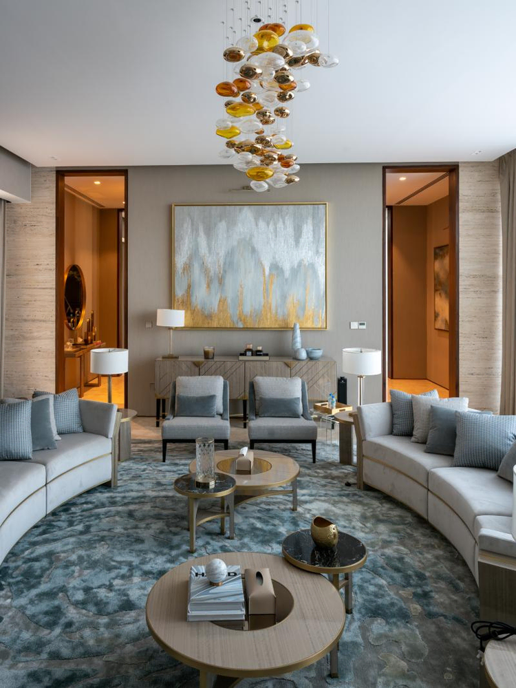 Modern Living Room with Peacock Mural and Sculpture Display