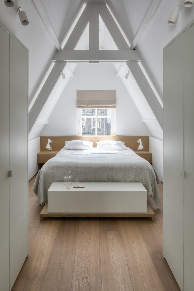 Serene Urban Retreat: A Minimalist Bedroom with Art Gallery Flair