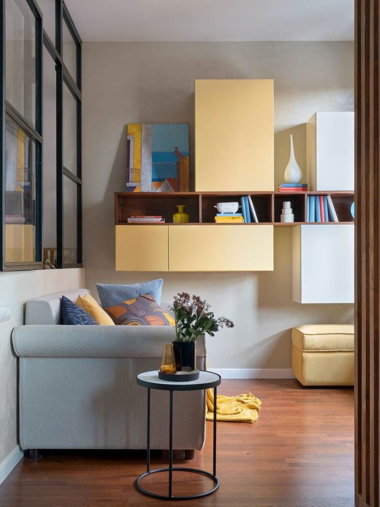 Modern Living Room Design with Floating Shelves and Exposed Beams
