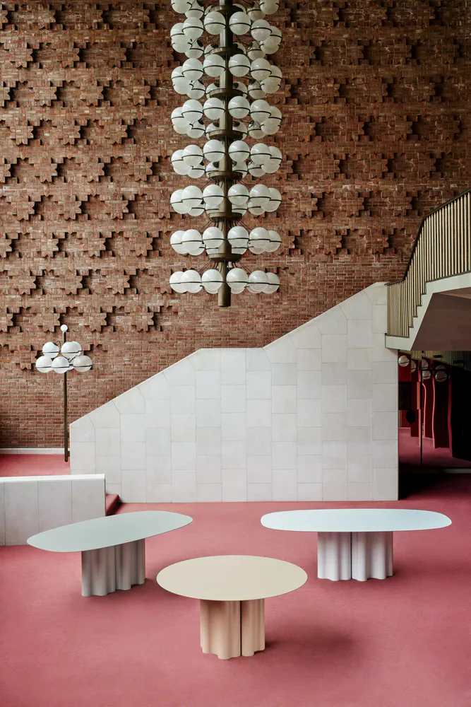 Modern Lobby Design with Brick Wall and Spherical Chandelier
